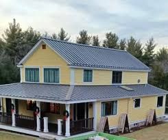 Yellow Metal Roof With Gray Siding