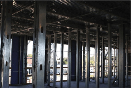 A building under construction with a lot of steel beams.