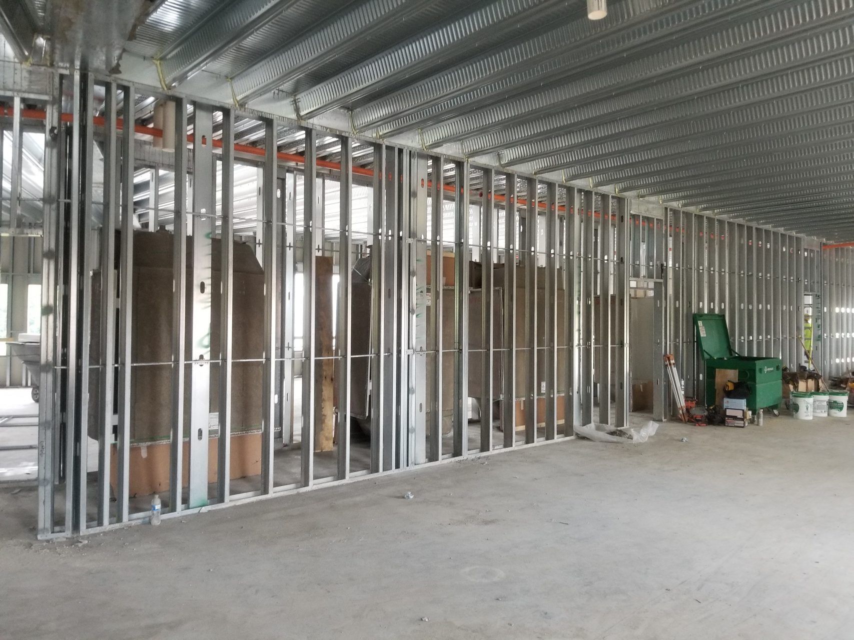 A large room with a lot of metal frames on the walls.