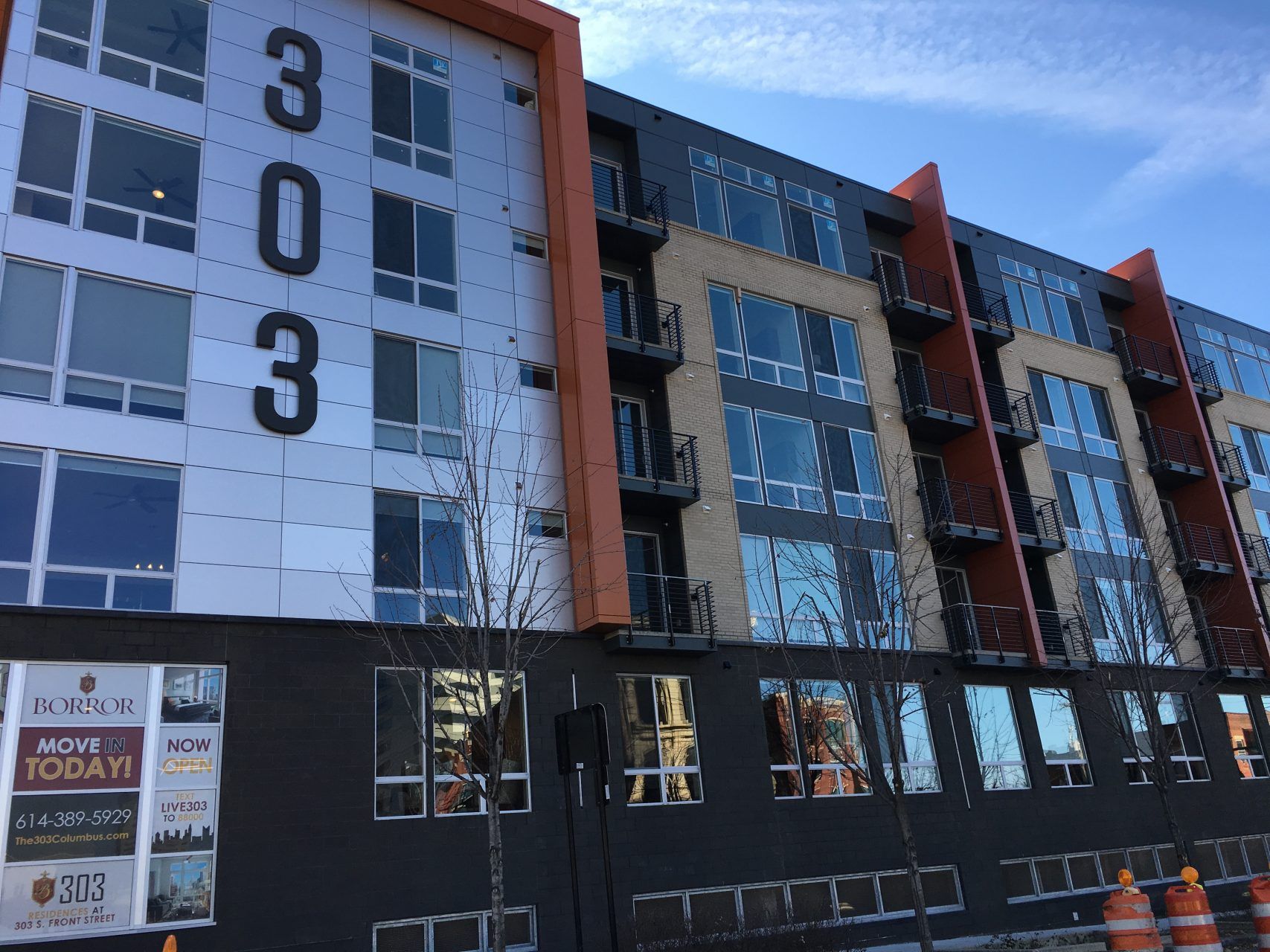 A large building with the numbers 303 on it.