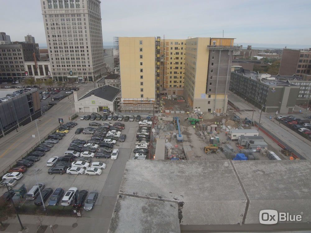 An aerial view of a city with ox blue written on the bottom right