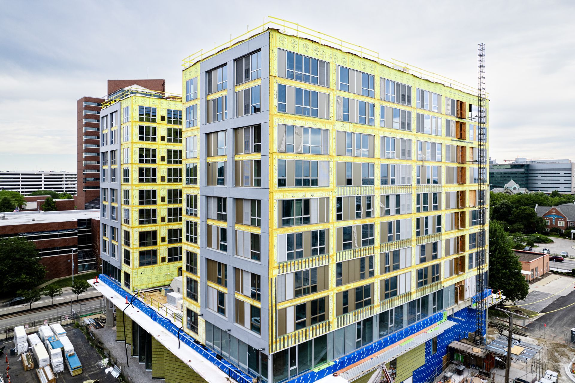 An aerial view of a large building under construction.