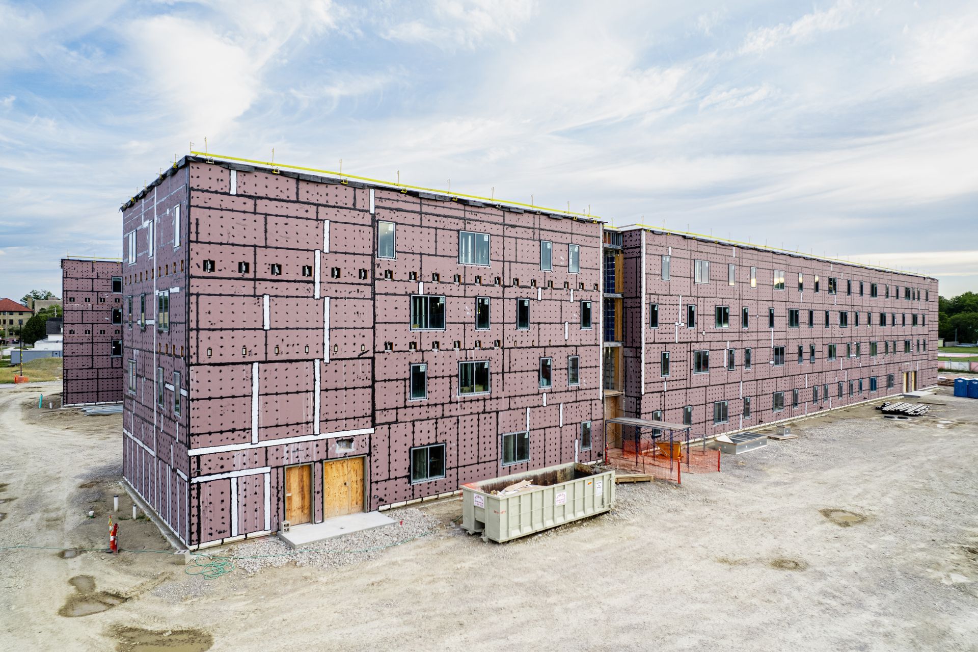 An aerial view of a large building under construction.