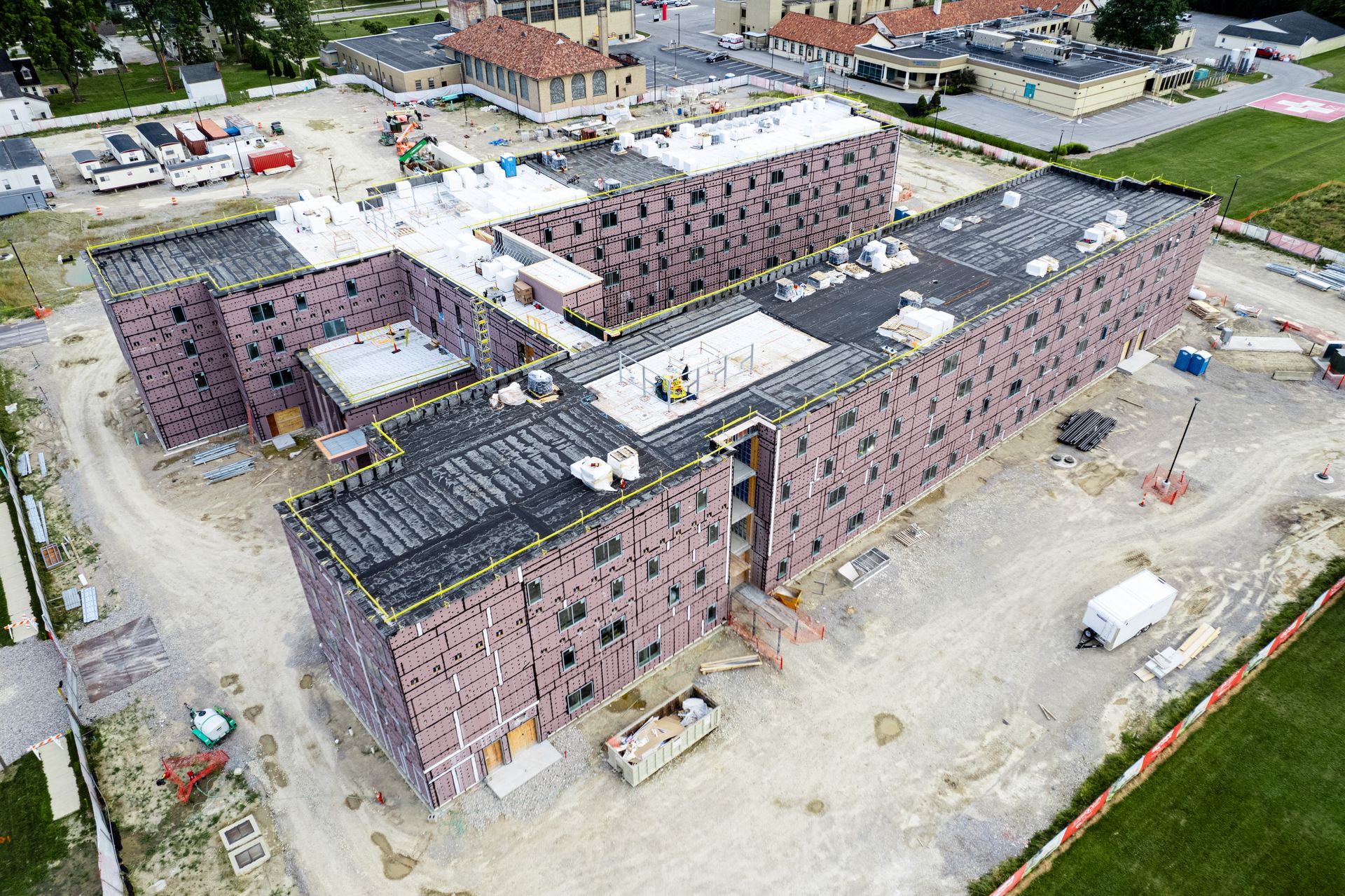 An aerial view of a large building under construction.