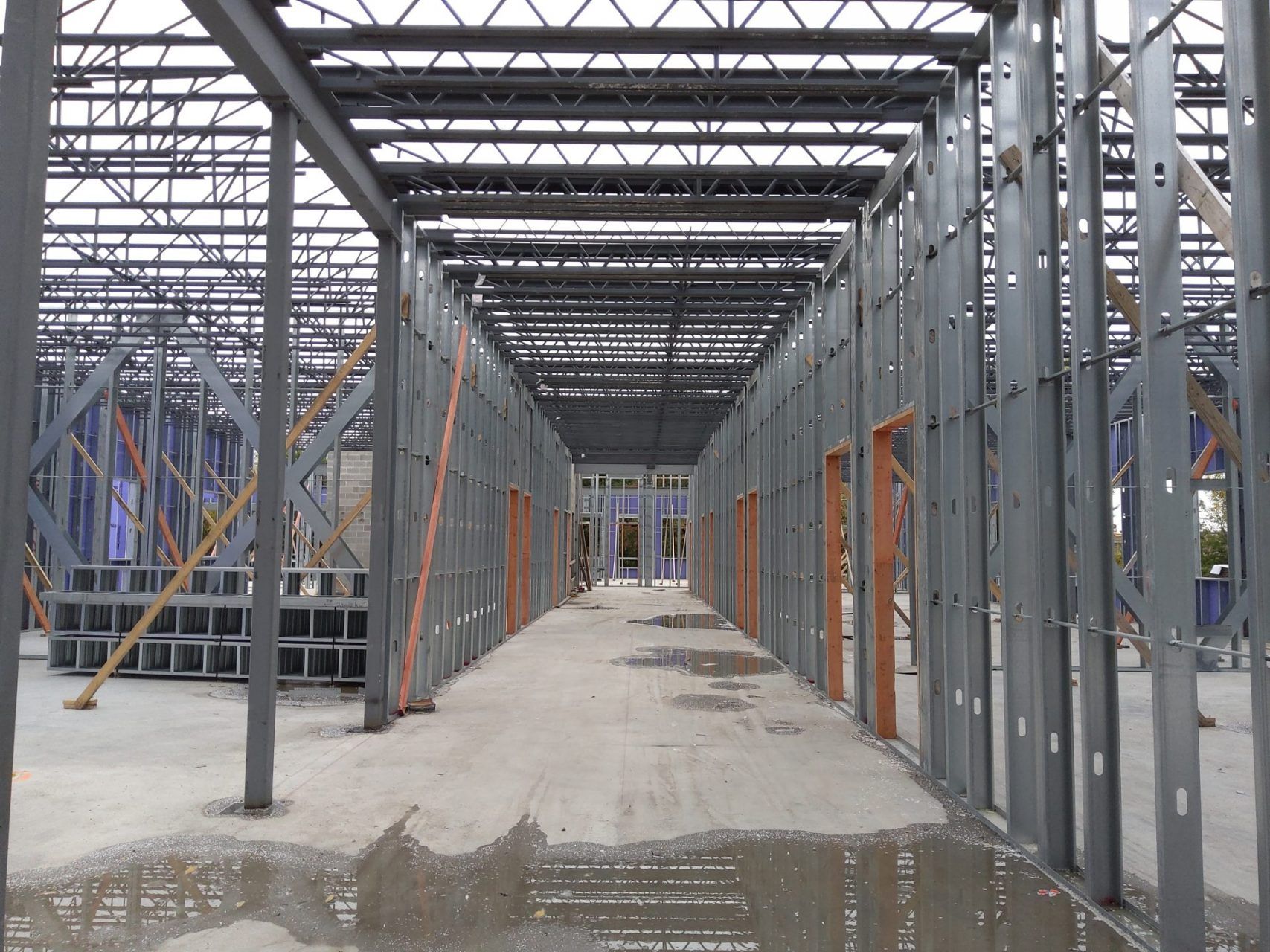 A large building under construction with a lot of steel beams.