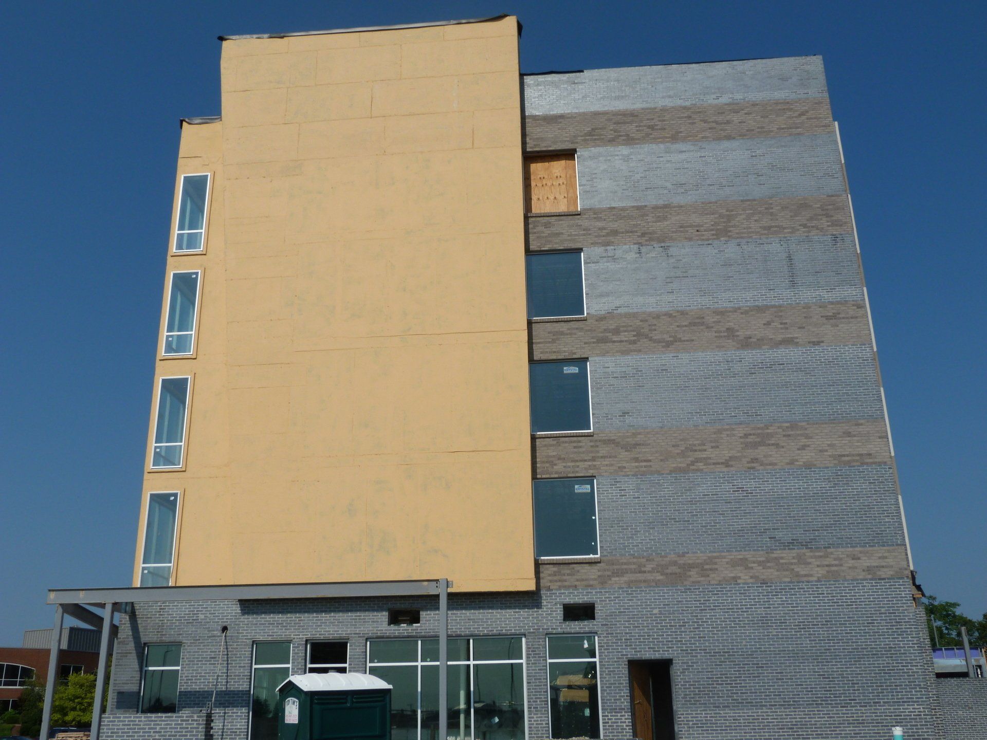A large building with a blue sky in the background.