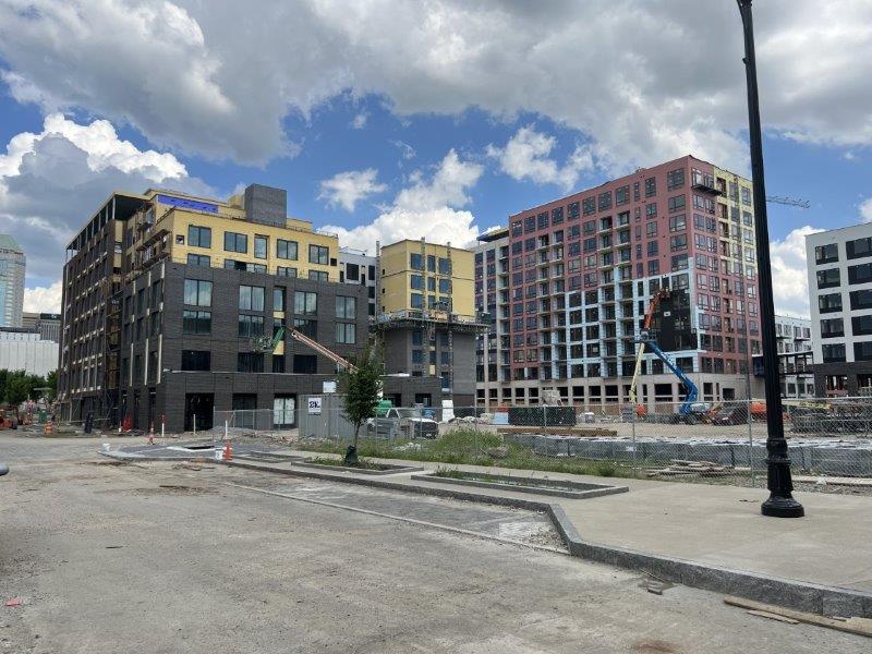 A large building is being built in the middle of a city.