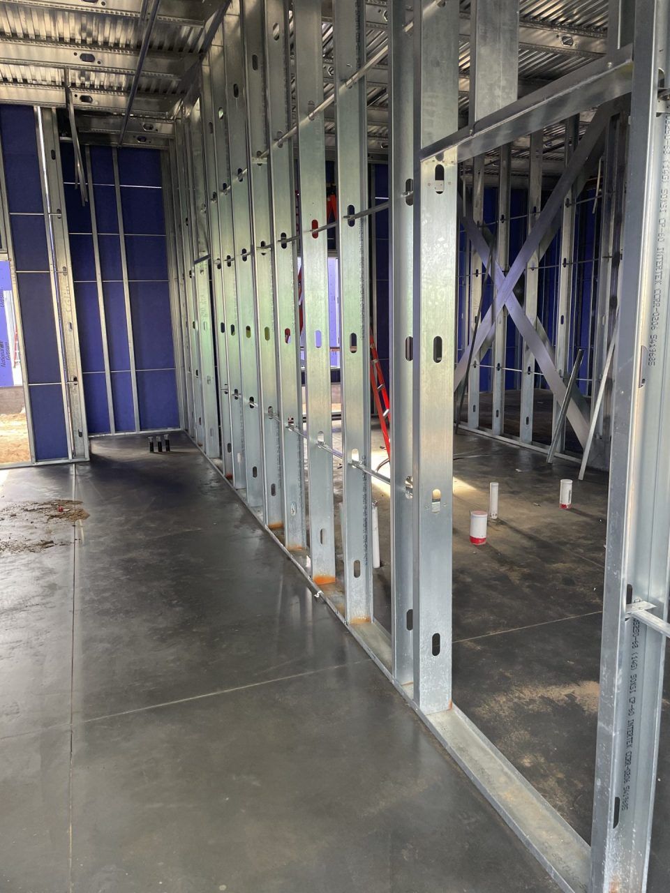 A building under construction with a lot of metal frames.