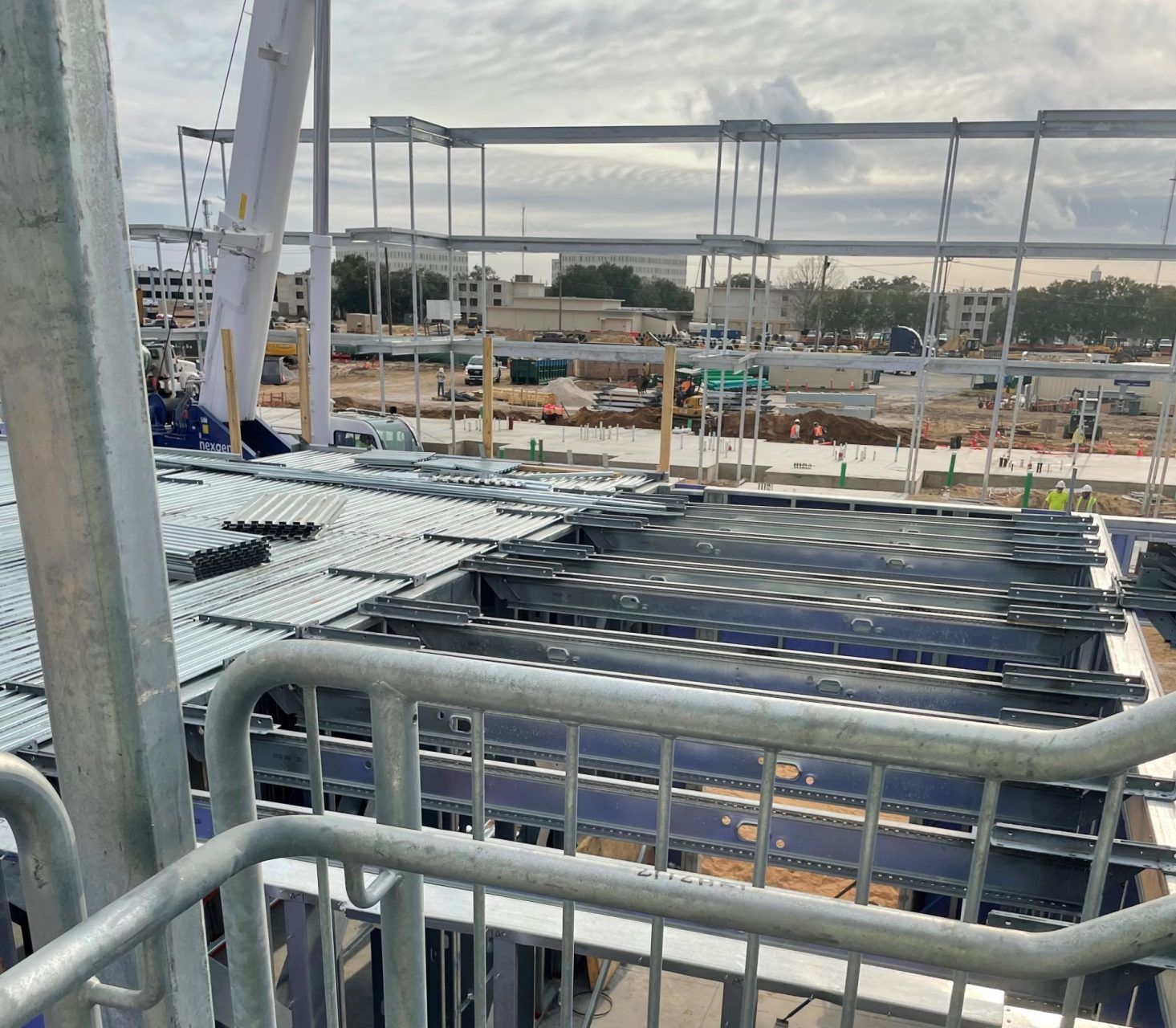 A view of a building under construction from a balcony.