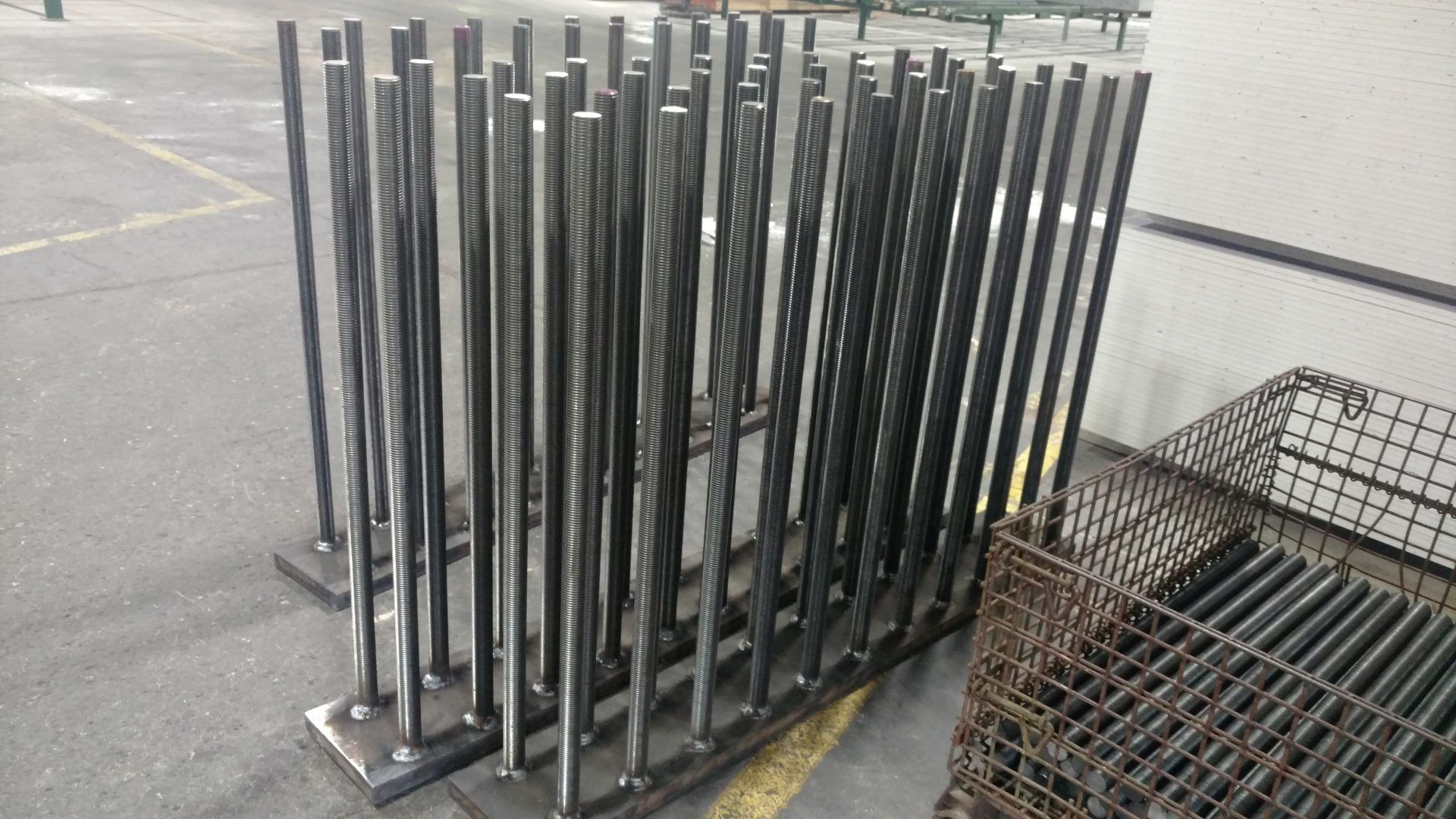 A bunch of metal poles are stacked on top of each other.