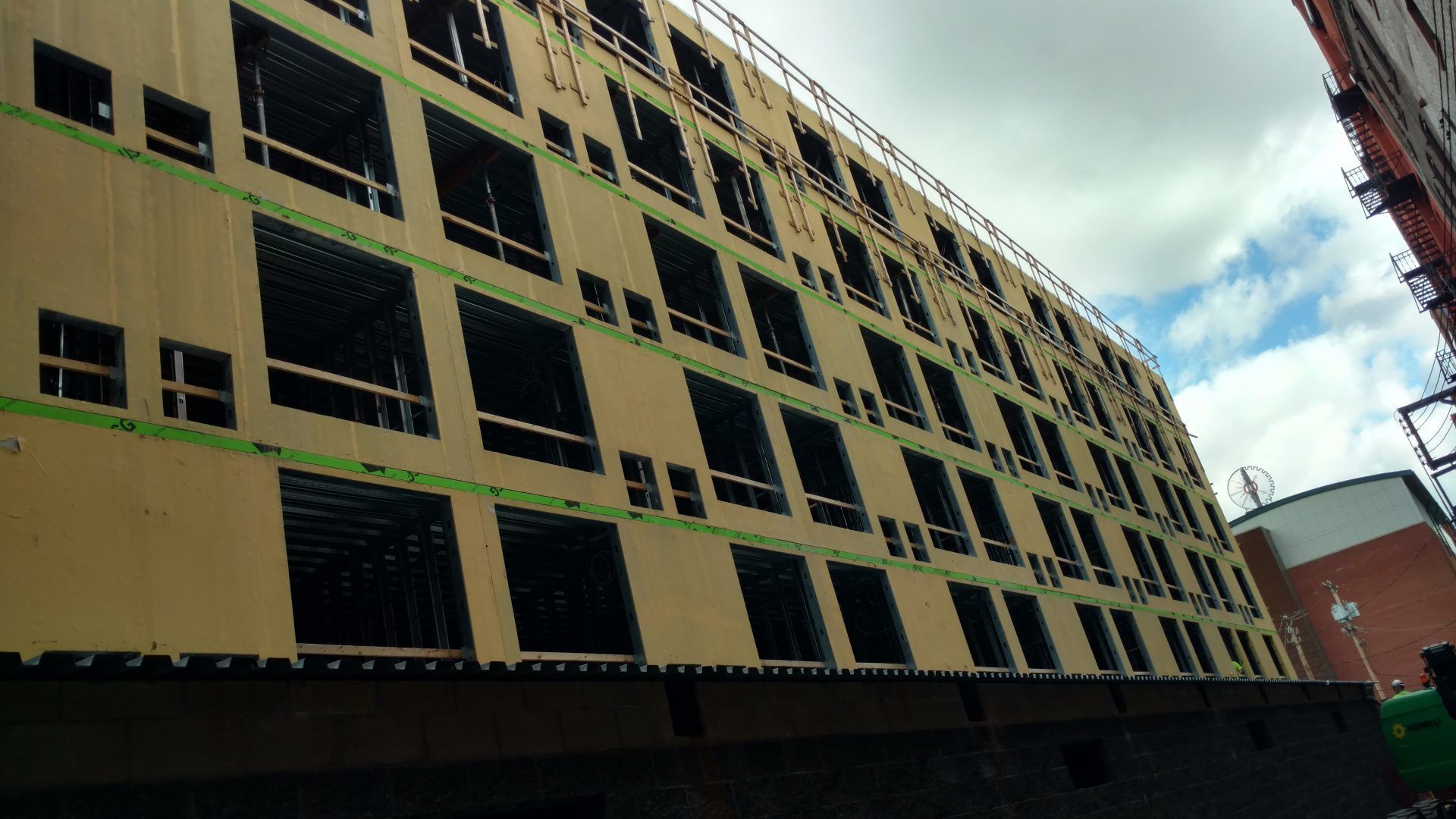 A large building under construction with a lot of windows.