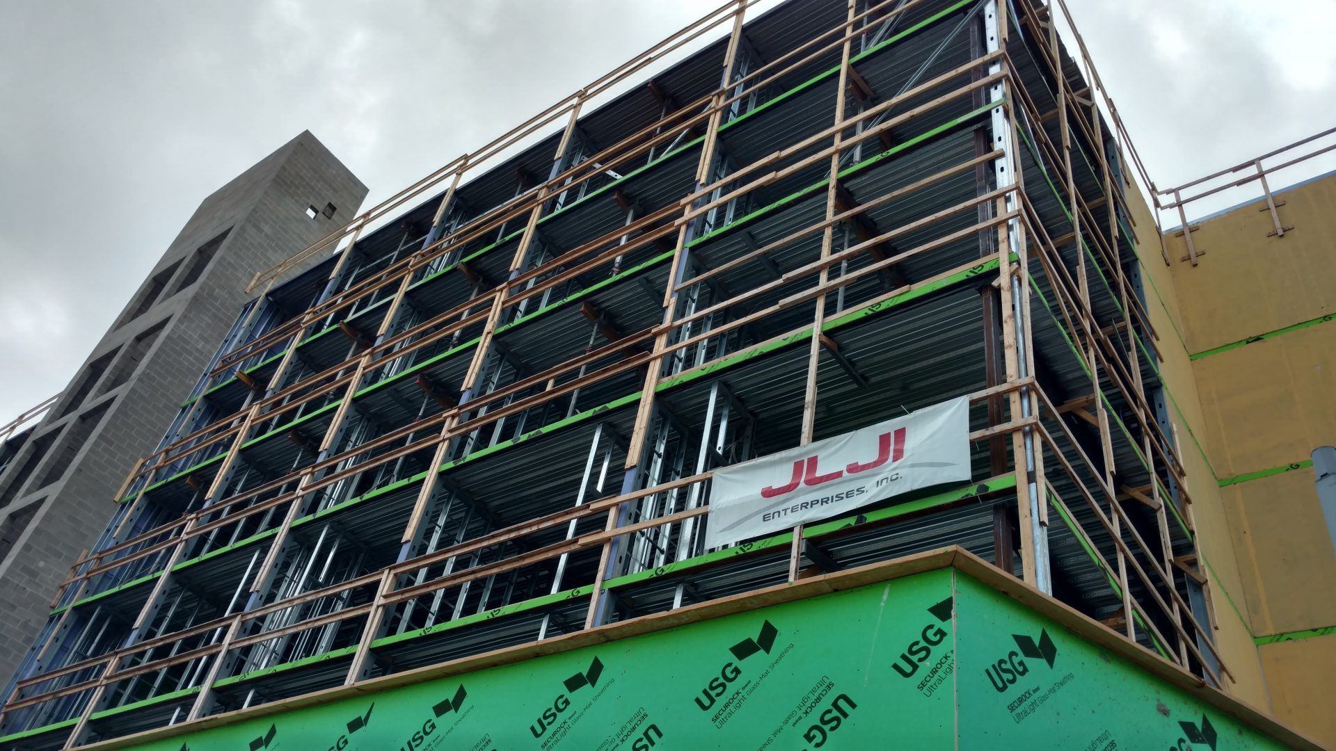 Looking up at a building under construction. 