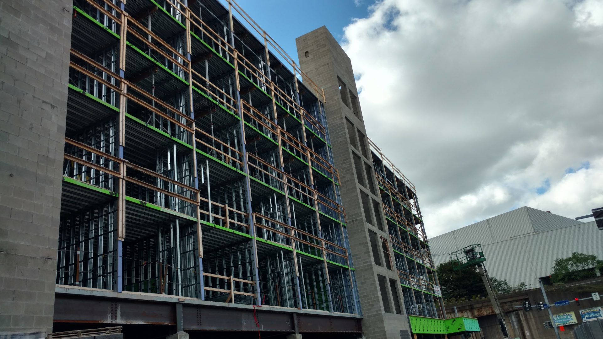 A large building under construction with scaffolding on the side of it.