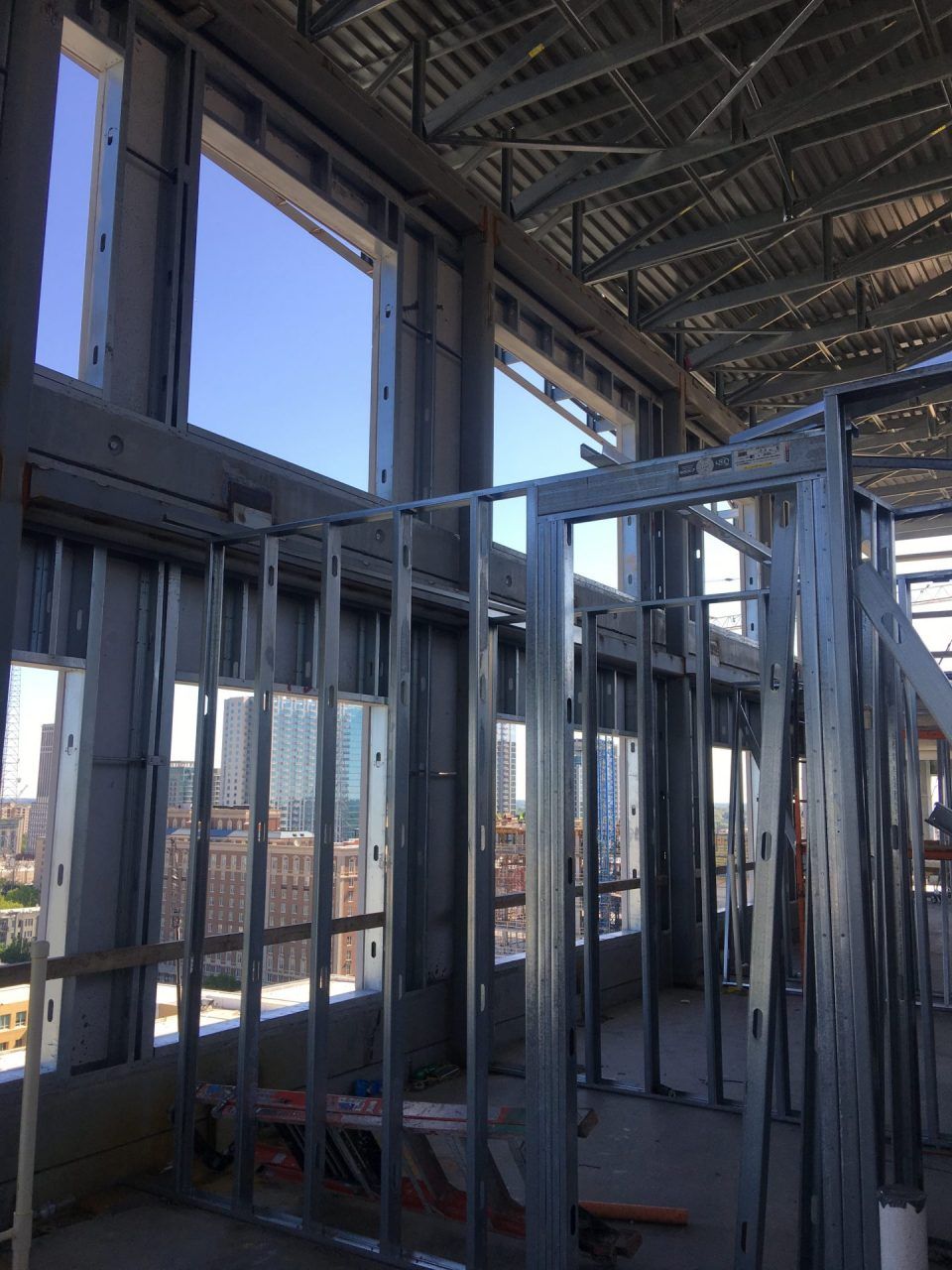 A building under construction with a lot of windows.