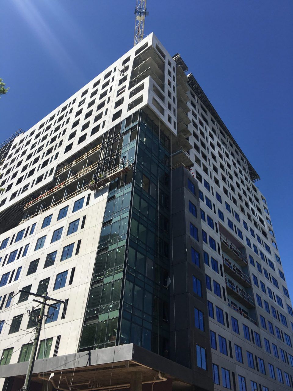 A tall building with a blue sky in the background.
