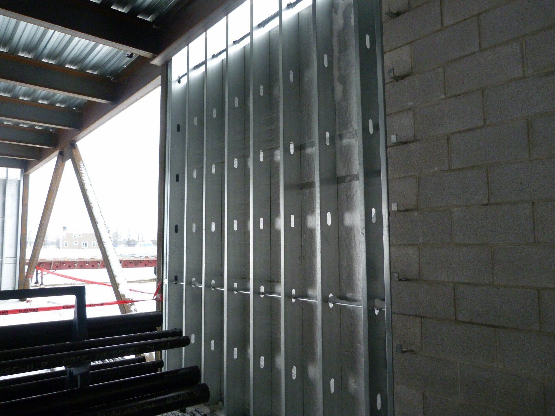 A brick wall with a metal frame around it.