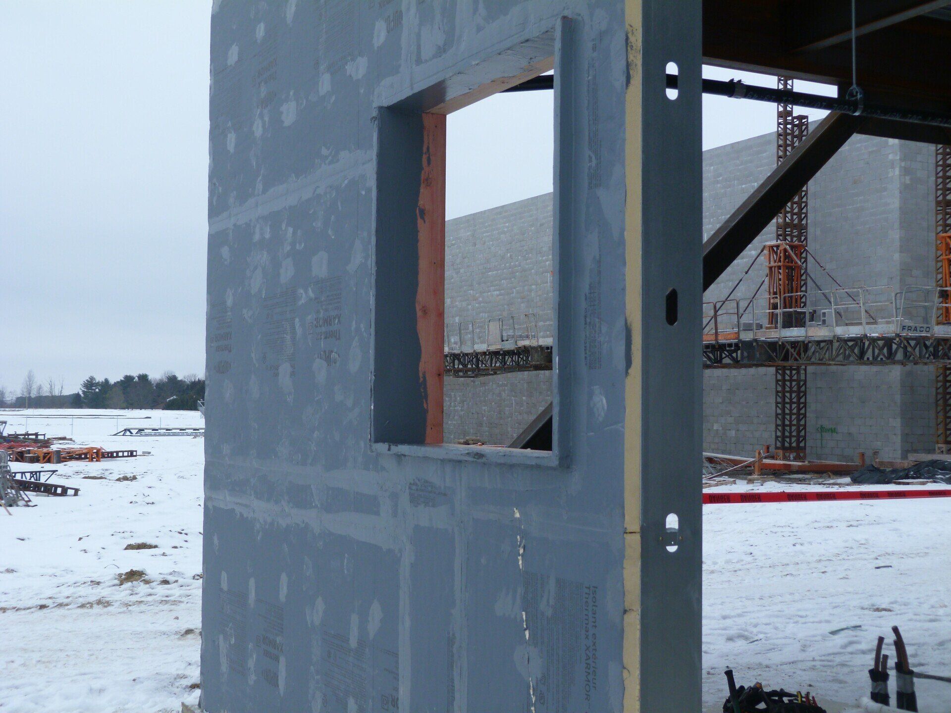 A building under construction with a window in it.