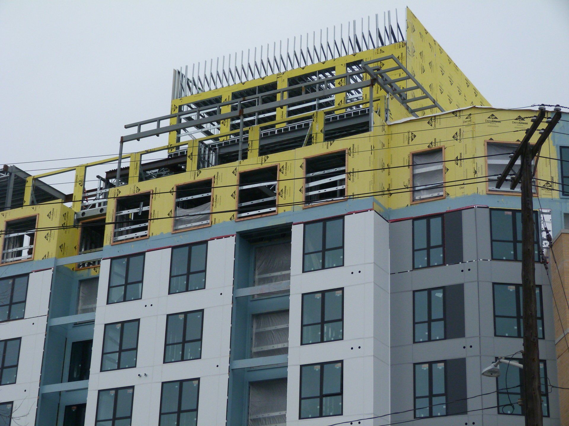 A building under construction with a lot of windows.