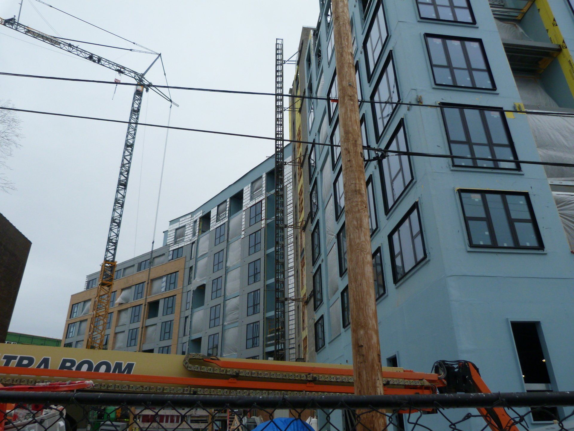 A building under construction with a sign that says extra room.