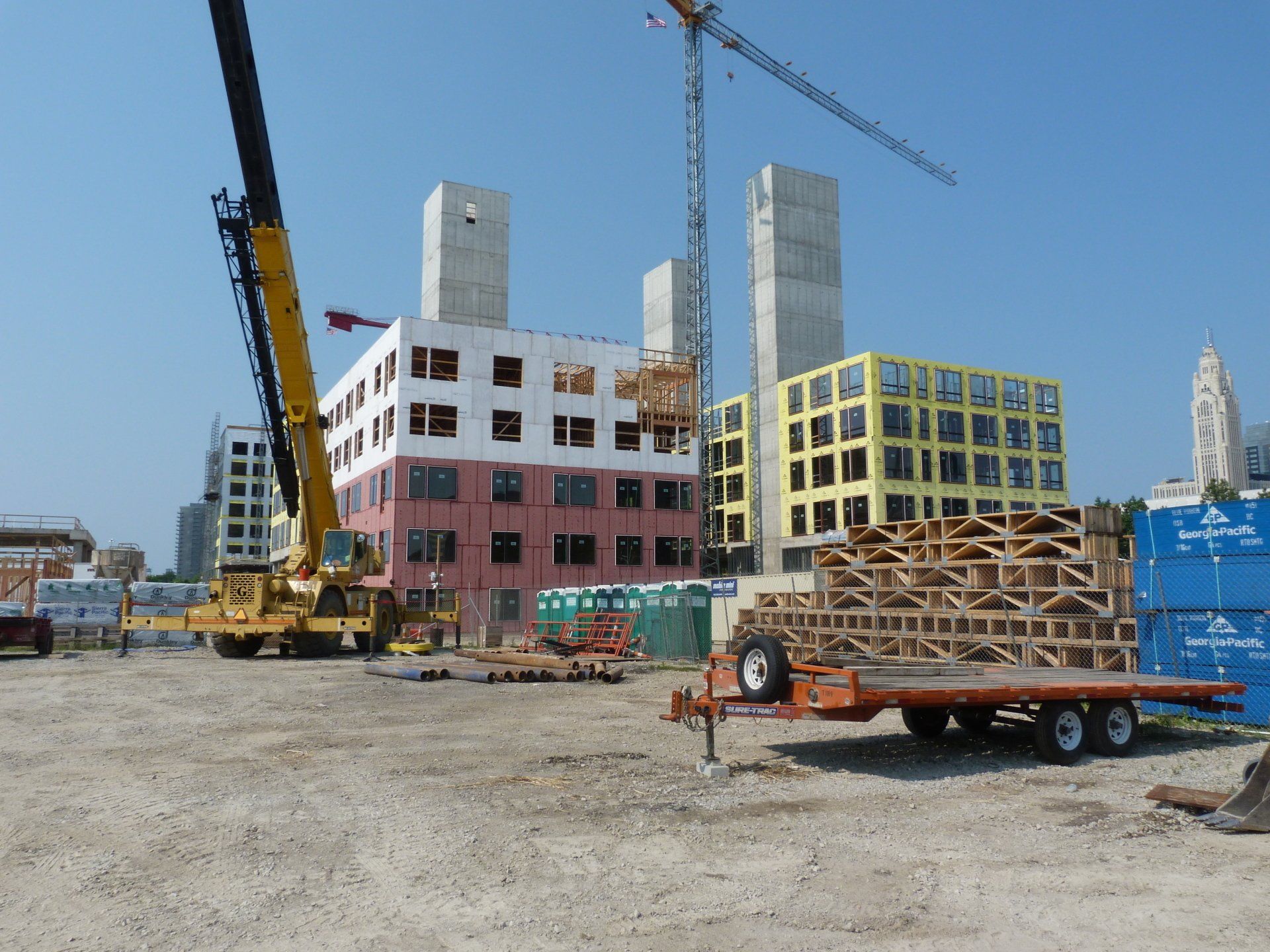 A construction site with a crane in the background.