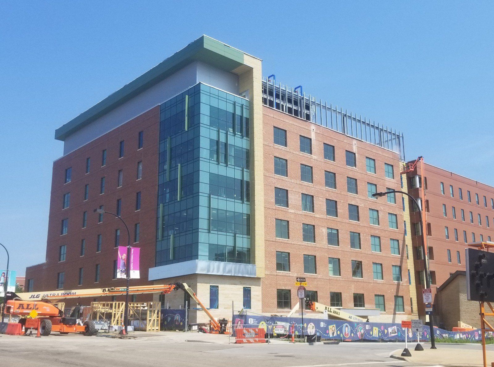 A large brick building with a blue sky in the background.