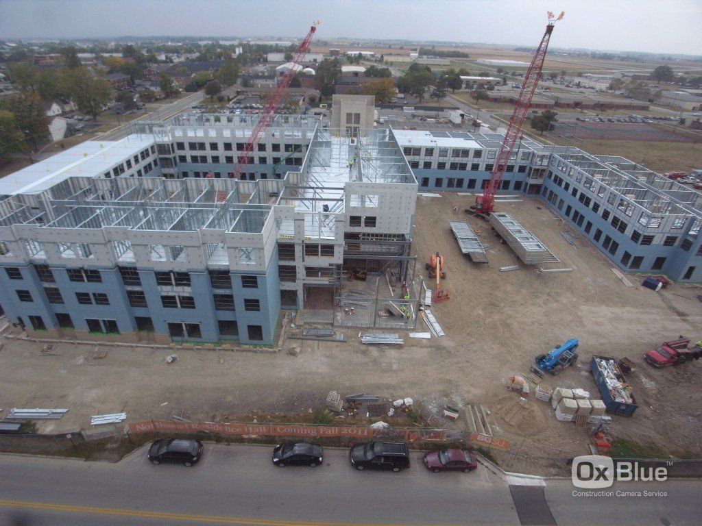 An aerial view of a large building under construction.