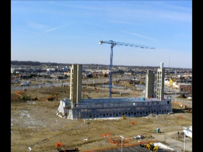 An aerial view of a large building under construction.