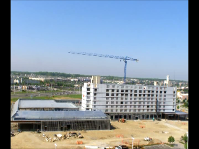 An aerial view of a large building under construction.