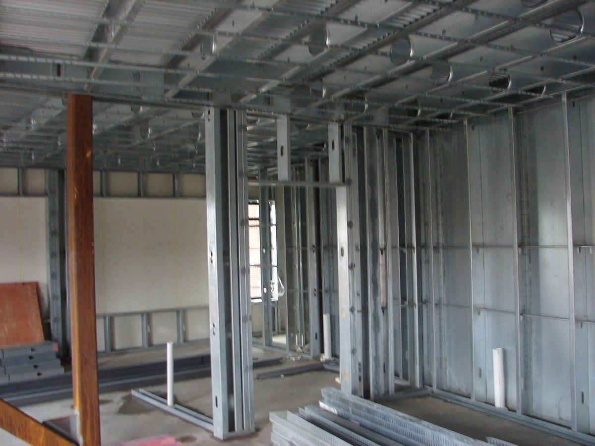 A building under construction with a lot of metal frames.