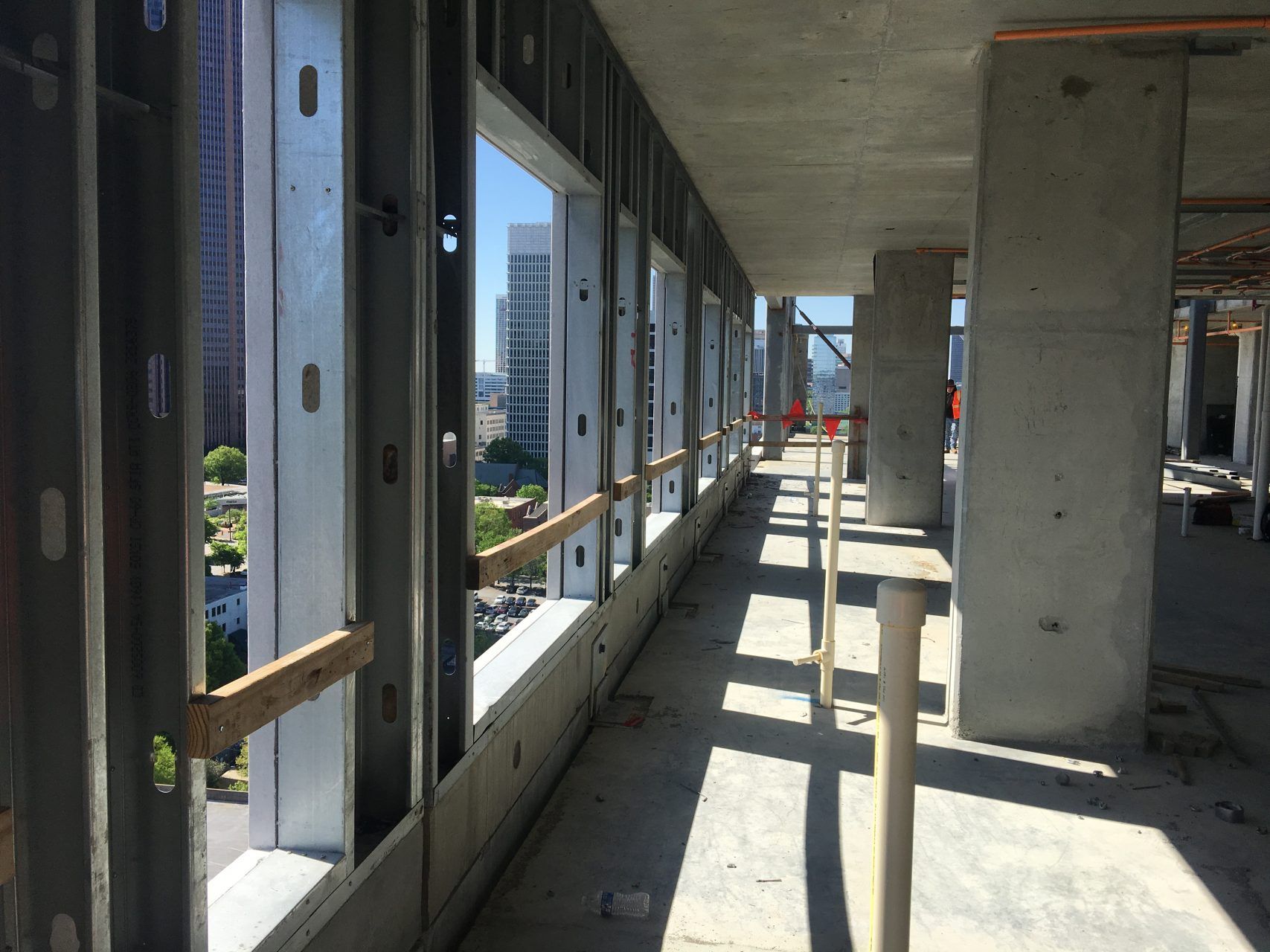 The inside of a building under construction with a lot of windows.