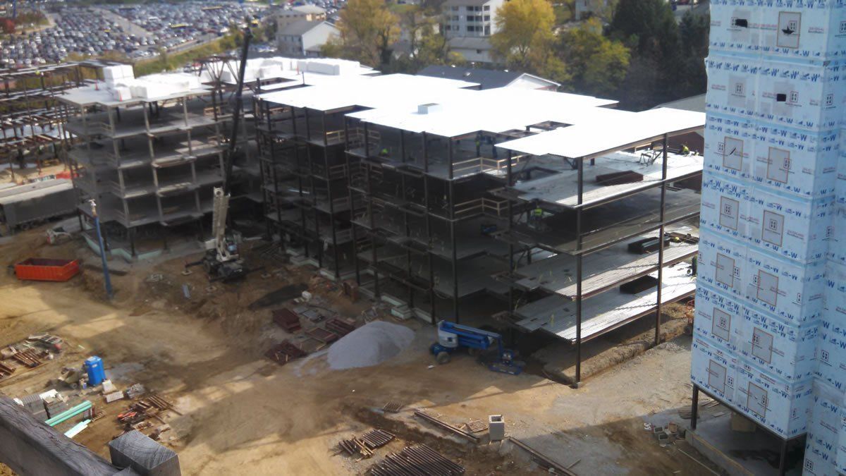 An aerial view of a large building under construction.