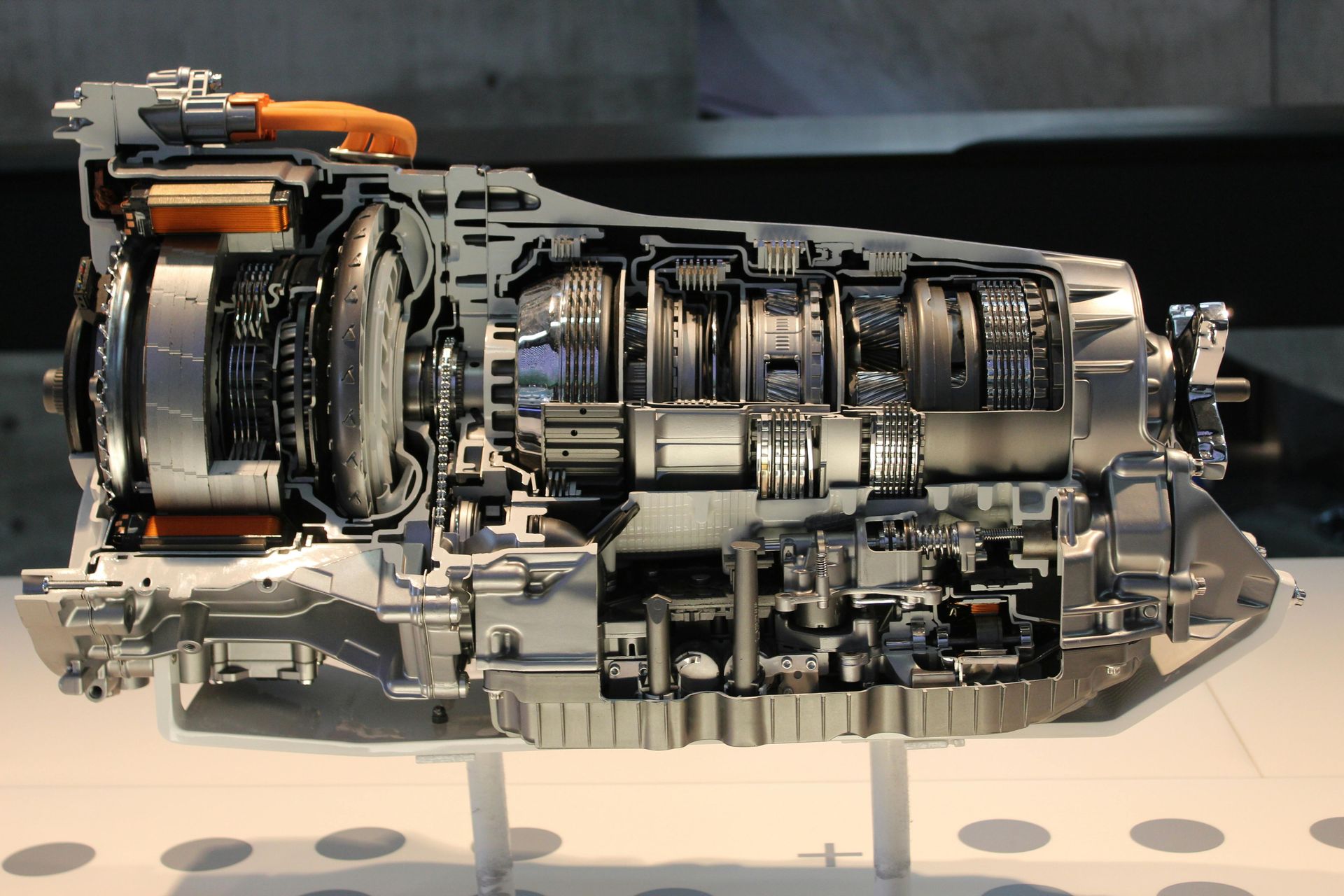 A cut in half model of a car gearbox on display