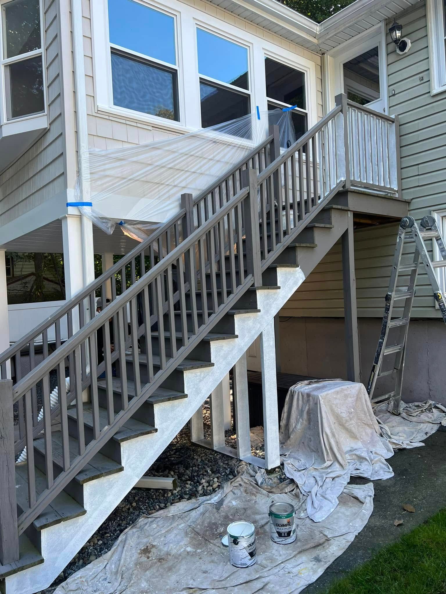 The stairs of a house are being painted.