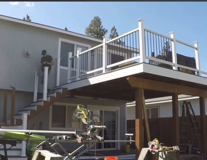 A house with a large deck and stairs