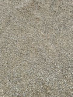 A close up of a pile of gravel on the ground.