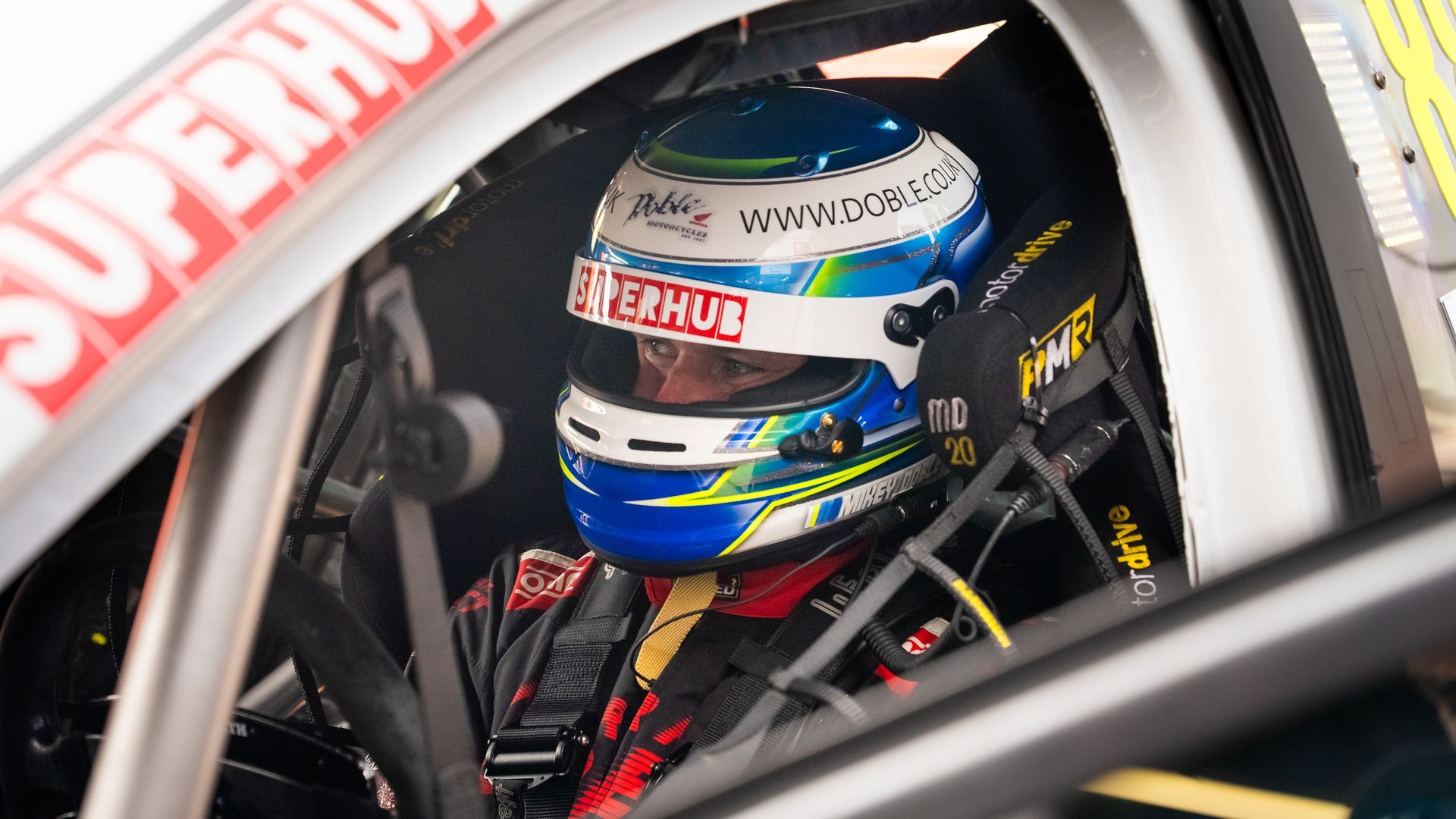 Mikey Doble BTCC 205 Donnington Park helmet with branding
