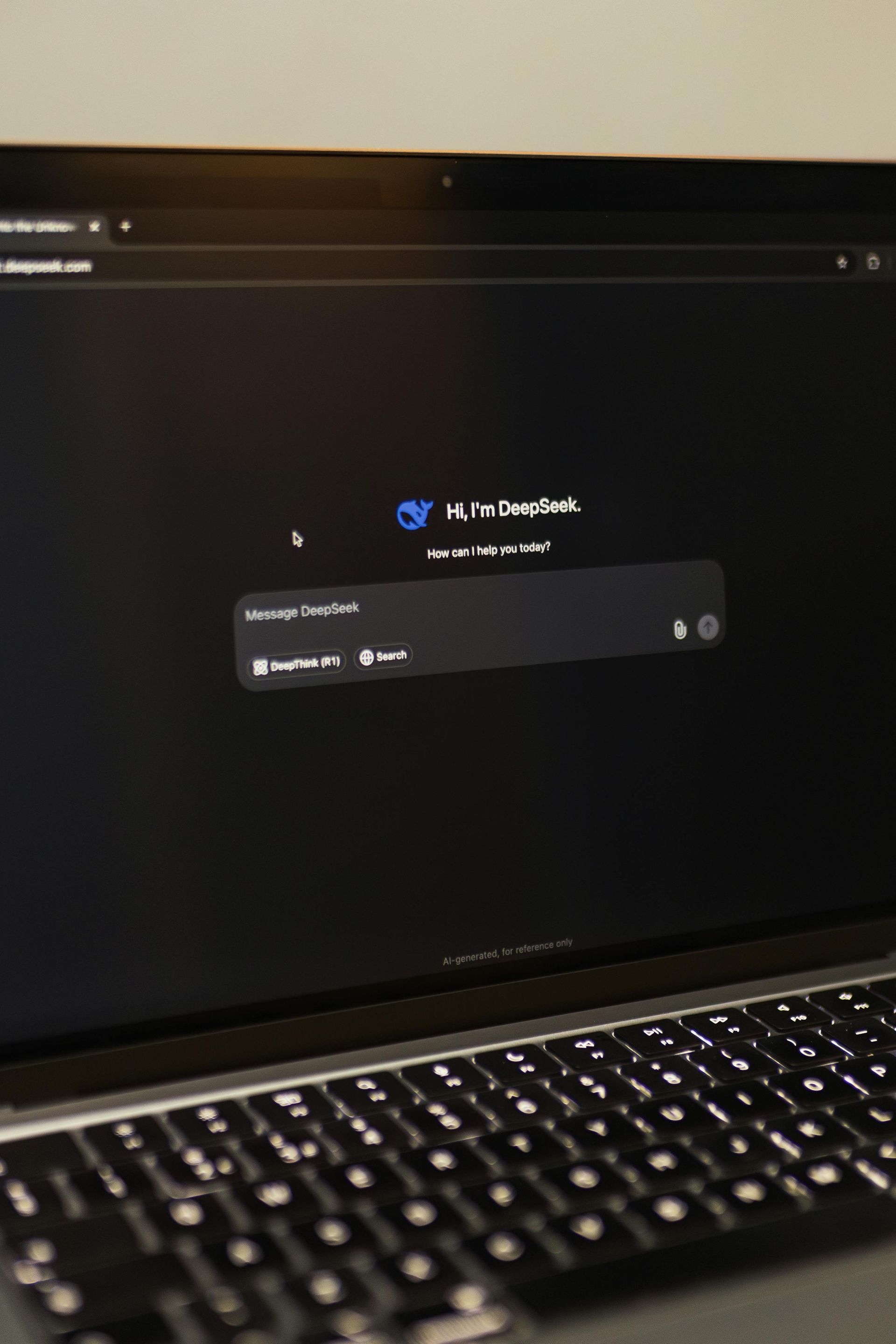 Dark laptop screen showing an ai login prompt with keyboard visible in the foreground