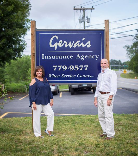 Gervais Insurance Agency team in front of sign