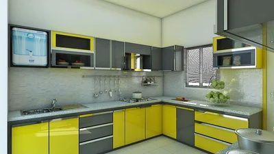 A kitchen with yellow cabinets and gray counter tops.