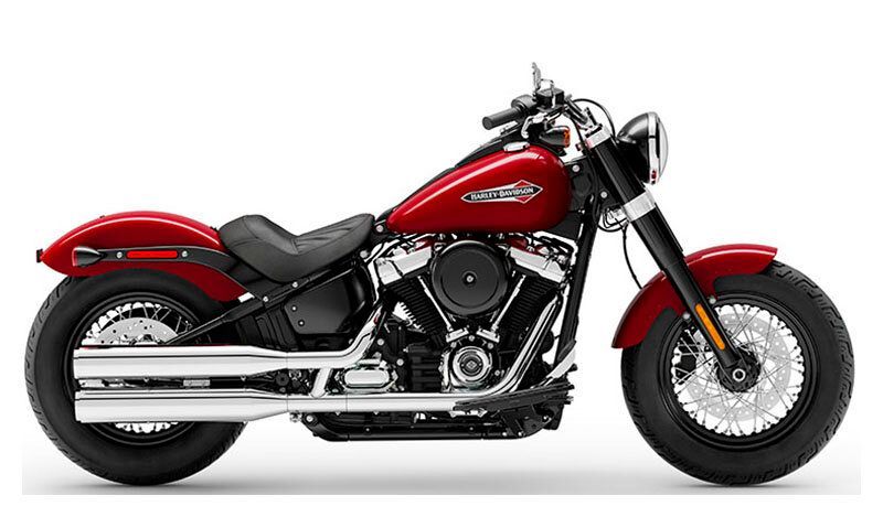 A red harley davidson motorcycle is shown on a white background.