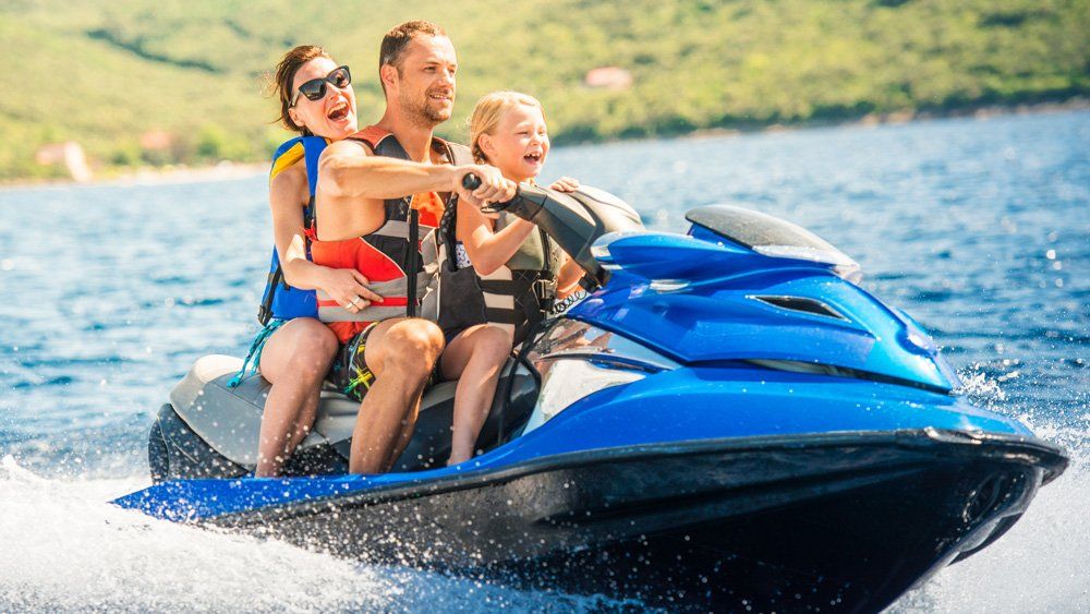 Happy Family Riding Jet Ski — Sylva, NC — Sylva Insurance Agency