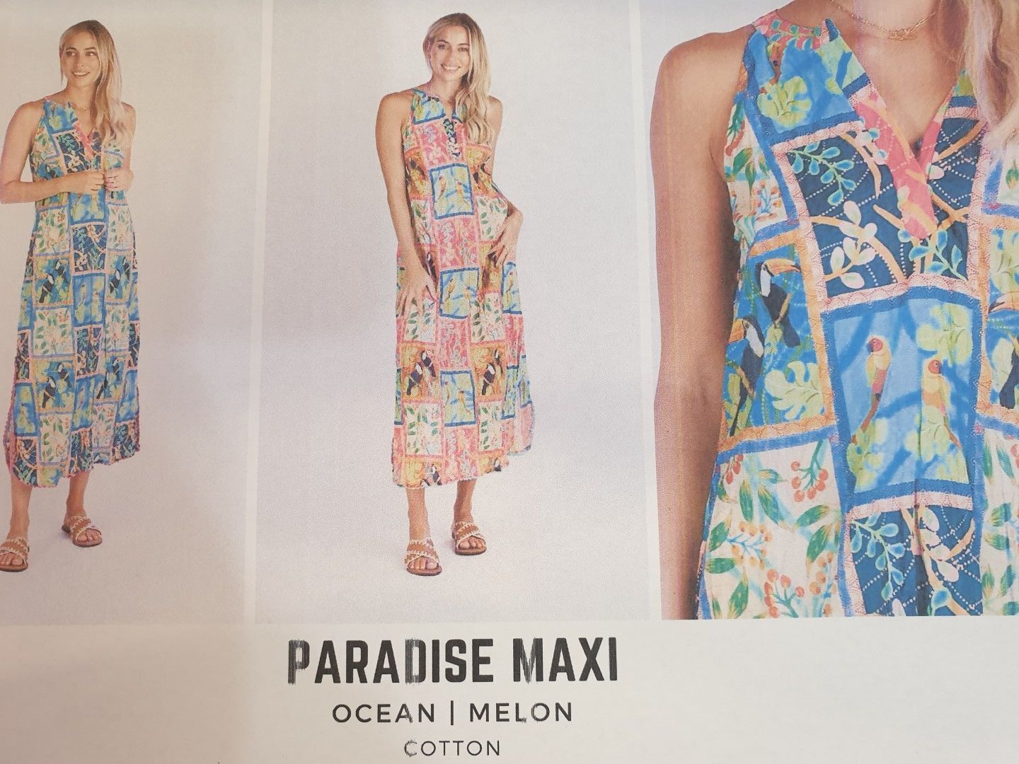 Two women modeling a colorful maxi dress. Printed in blue, pink, and yellow floral squares; 