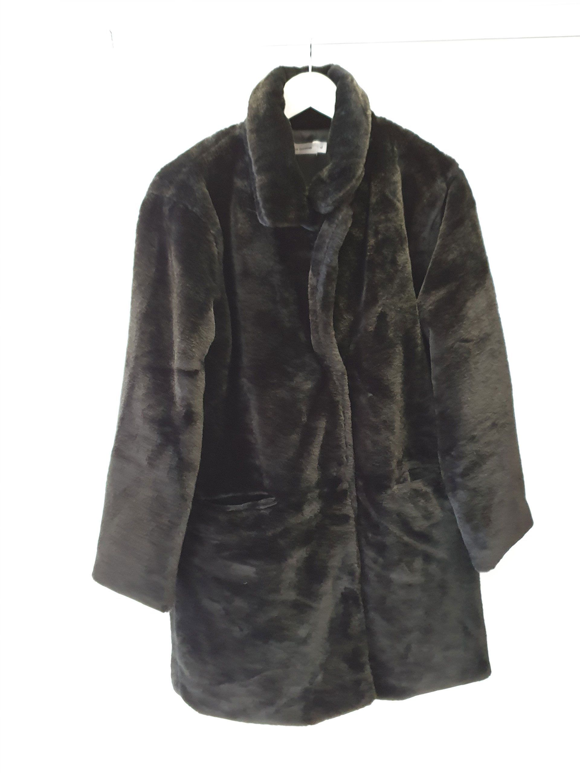 Brown faux fur coat hanging on a white hanger.
