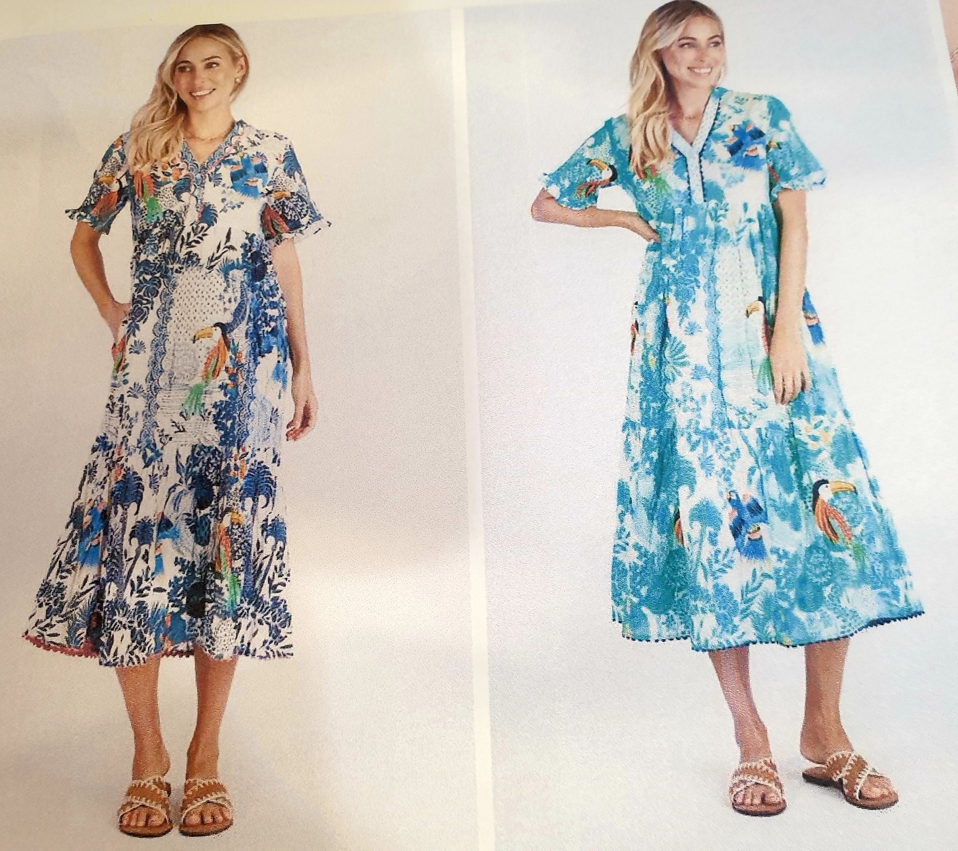 Two women wearing blue floral print dresses; one with a ruffled hem, the other with button front, both with smiles.