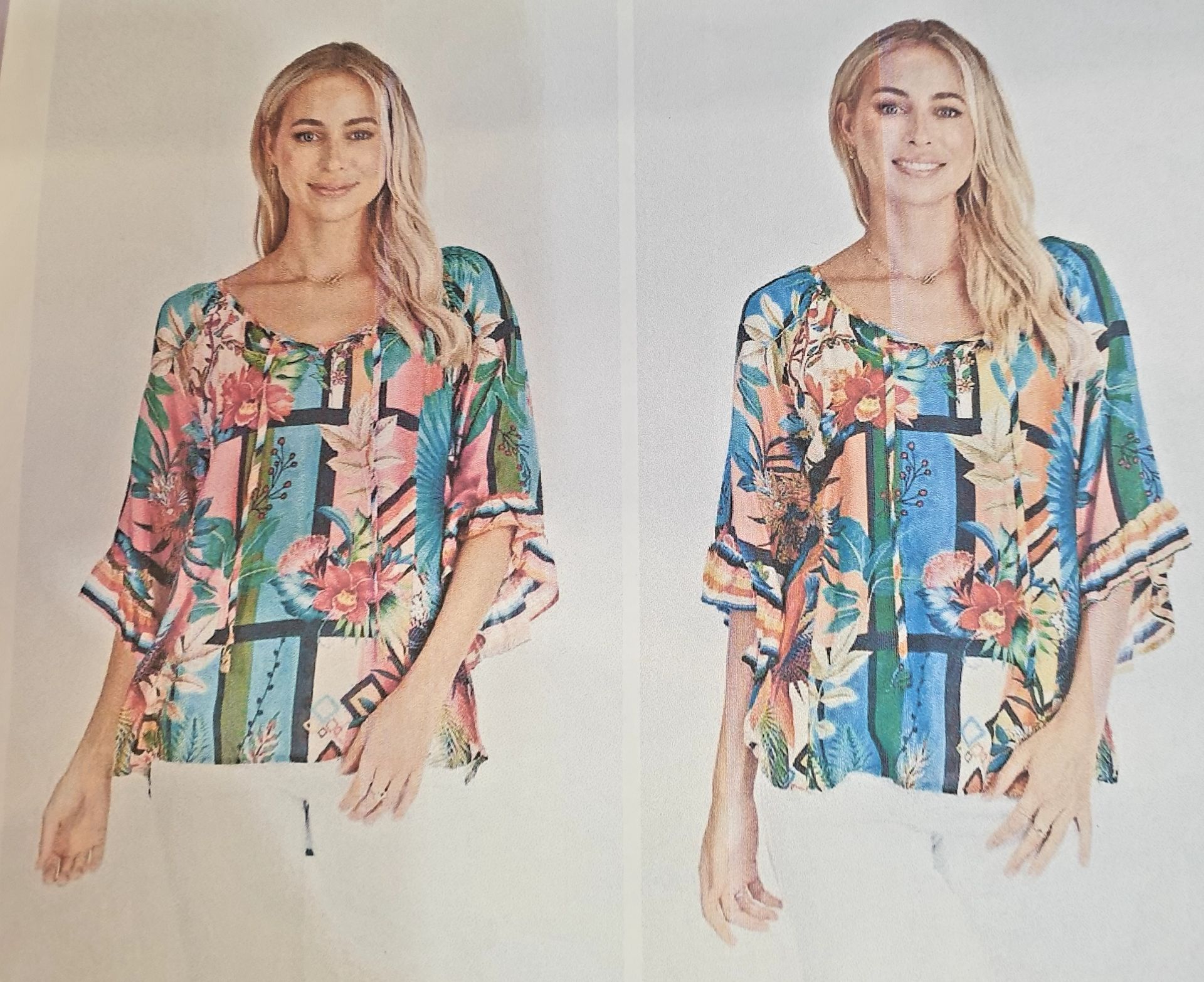 Two women wearing colorful floral print blouses, posing in front of a white backdrop.