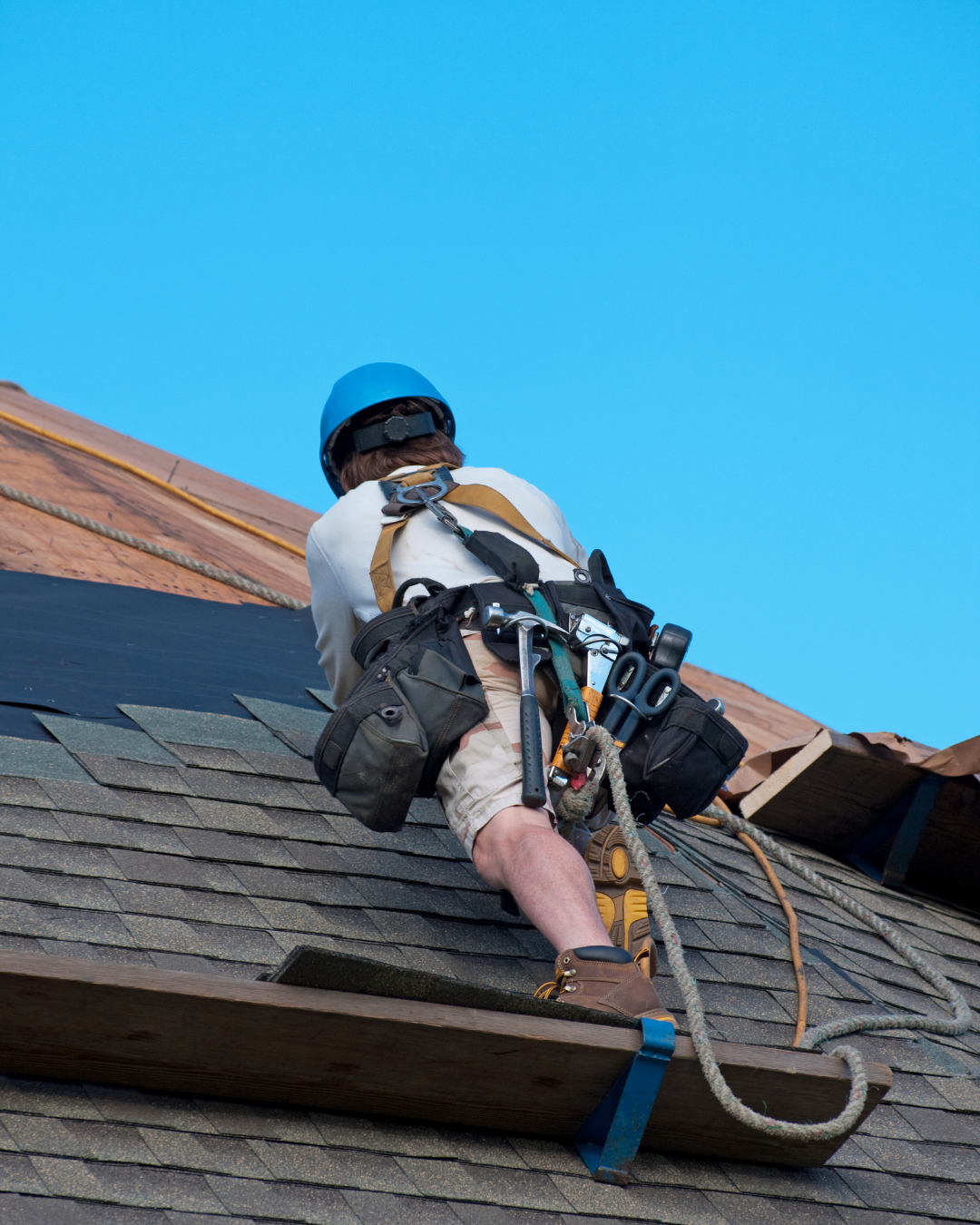 licensed roofing contractor doing a shingle roof repair