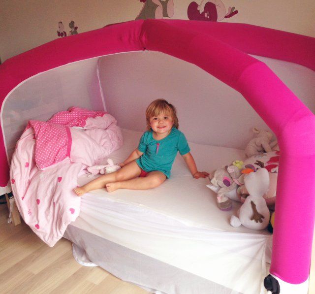Child waking up in CloudCuddle bed tent