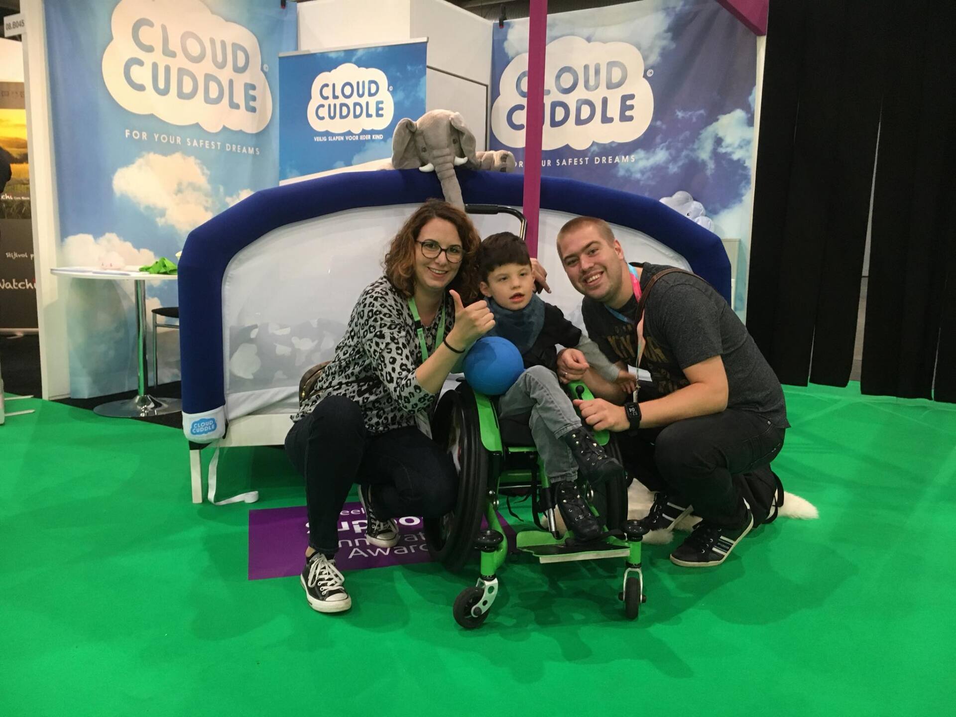 Family posing in front of CloudCuddle
