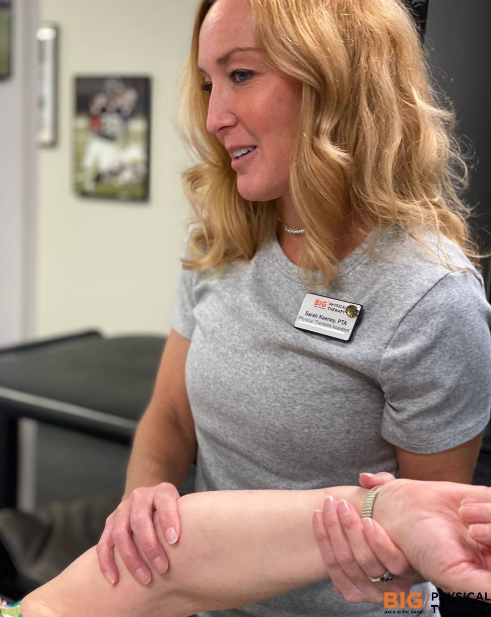 physical therapist working with a patient 