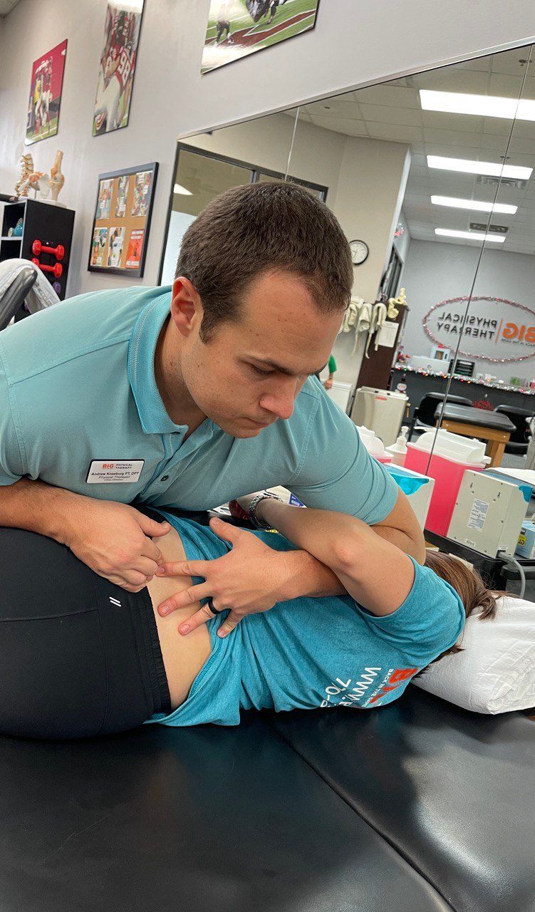 physical therapist providing physical therapy for back pain